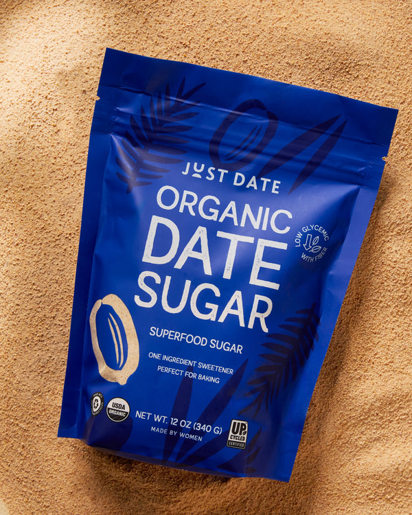 Blue package of Just Date Organic Date Sugar on a beige background